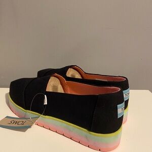 TOMS Black Canvas Slip-Ons with Neon Soles